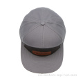 7 panel de tapa snapback con parche de cuero